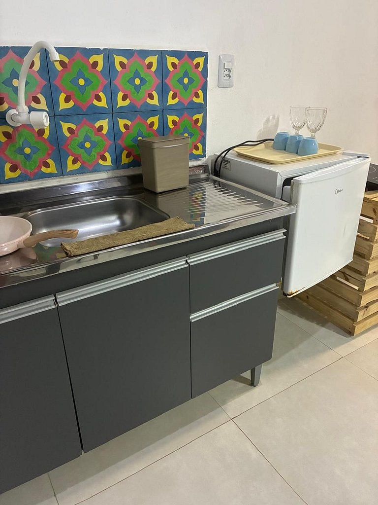 Apartamento 04 - Sala e cozinha, quarto superior com escadas